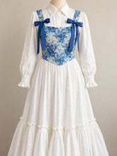 Long sleeves with ruffle cuffs, button-down collar, tiered hem, bow-tie straps