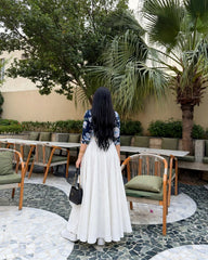 Elegant blue print top with full.flair white skiet