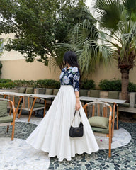 Elegant blue print top with full.flair white skiet