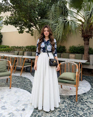 Elegant blue print top with full.flair white skiet