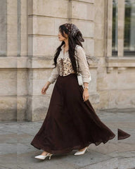 Beautiful printed corset with beige shirt % brown skirt