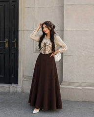 Beautiful printed corset with beige shirt % brown skirt
